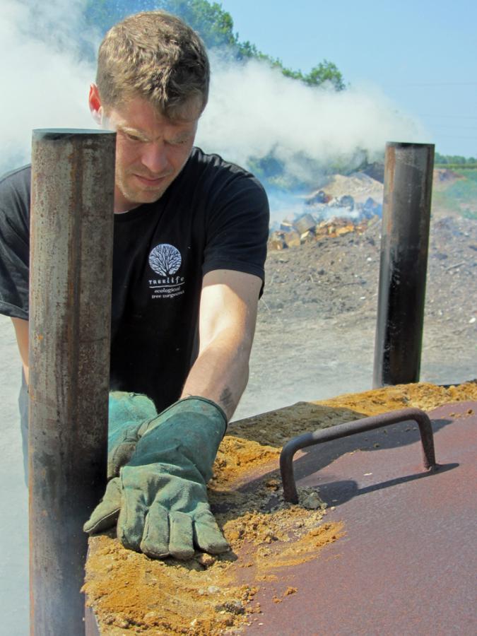 Tim Sealing Charcoal Kiln.jpg tim Sealing Charcoal Kiln.jpg